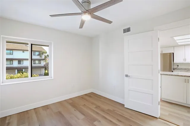 a kitchen with stainless steel appliances granite countertop a refrigerator and a stove