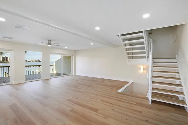 a view of kitchen and hall with wooden floor