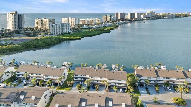 a front view of a house with a lake view