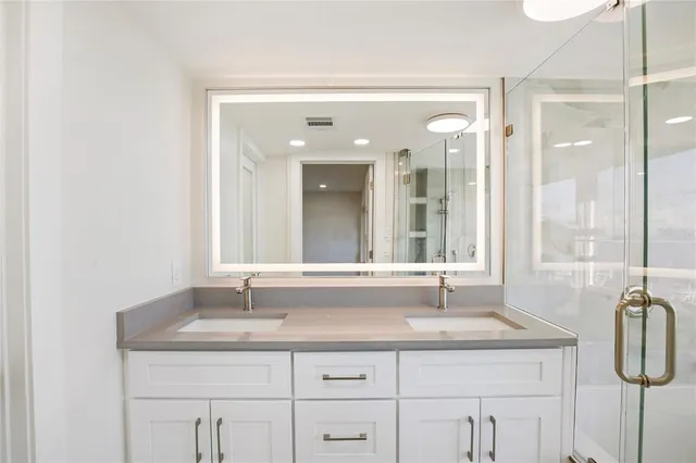 a view of a bathroom with tub and sink