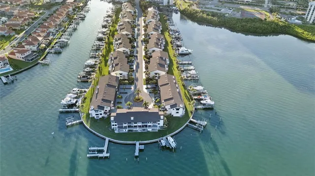 an aerial view of a residential houses with outdoor space