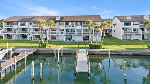 a view of front door of house with a yard