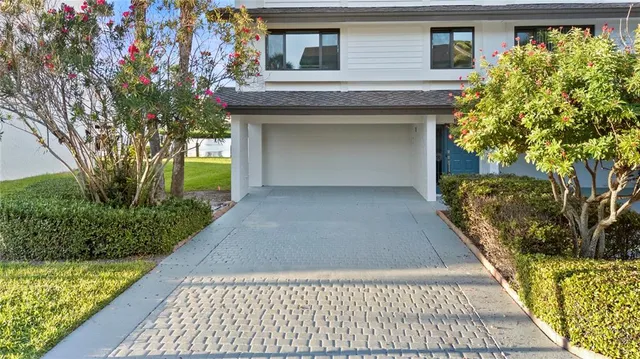 a view of a room with wooden floor and white walls
