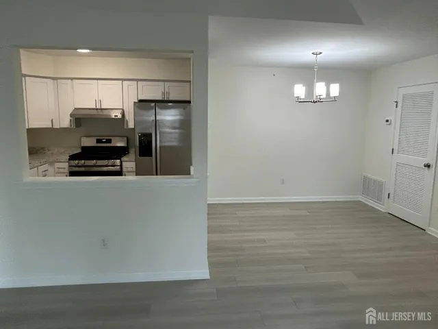 a view of a kitchen with a sink