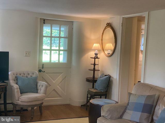 776 W Road West Grove, PA 19390 - Photo 14 of 26 a living room with furniture a mirror and a window