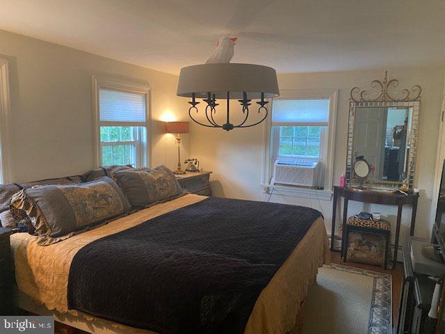 776 W Road West Grove, PA 19390 - Photo 18 of 26 a bedroom with a bed a mirror and furniture