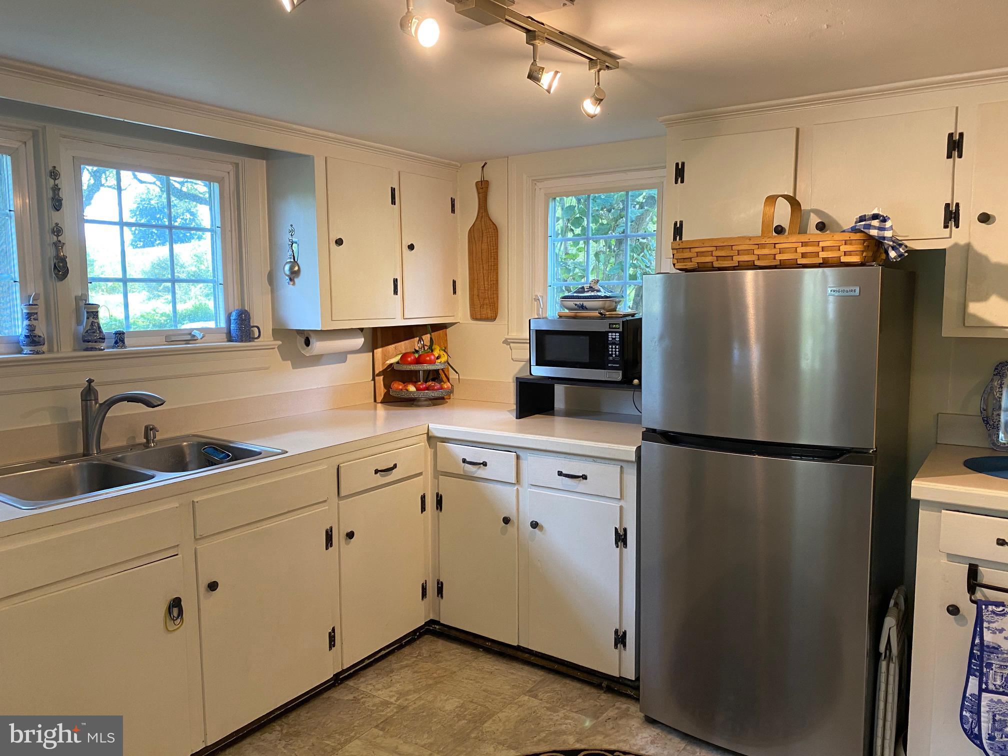 776 W Road West Grove, PA 19390 - Photo 7 of 26 a kitchen with appliances a sink a window and cabinets