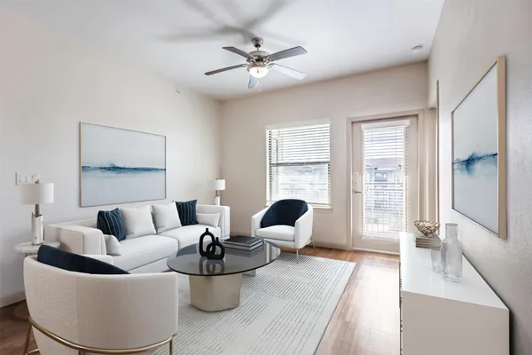 a living room with furniture and a large window
