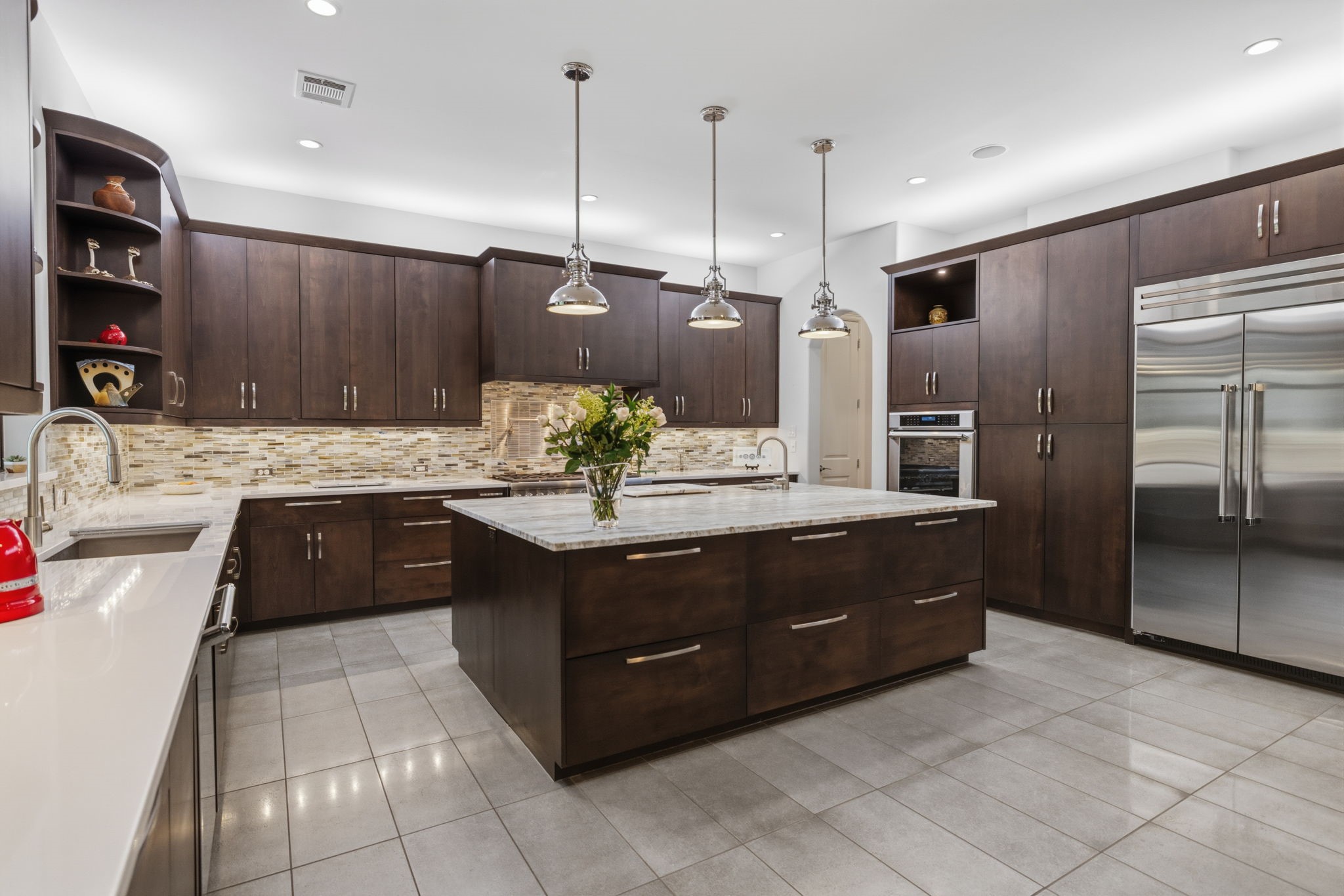 6918 Comanche Bend Montgomery, TX 77316 - Photo 22 of 50 This GOURMET kitchen is equipped with high-end appliances, leather like granite, soft-close drawers and cabinets, a built-in refrigerator that will stay with the home, under-cabinet lighting, and a prep sink, all thoughtfully designed to create a beautiful and functional space for cooking, gathering, and entertaining.