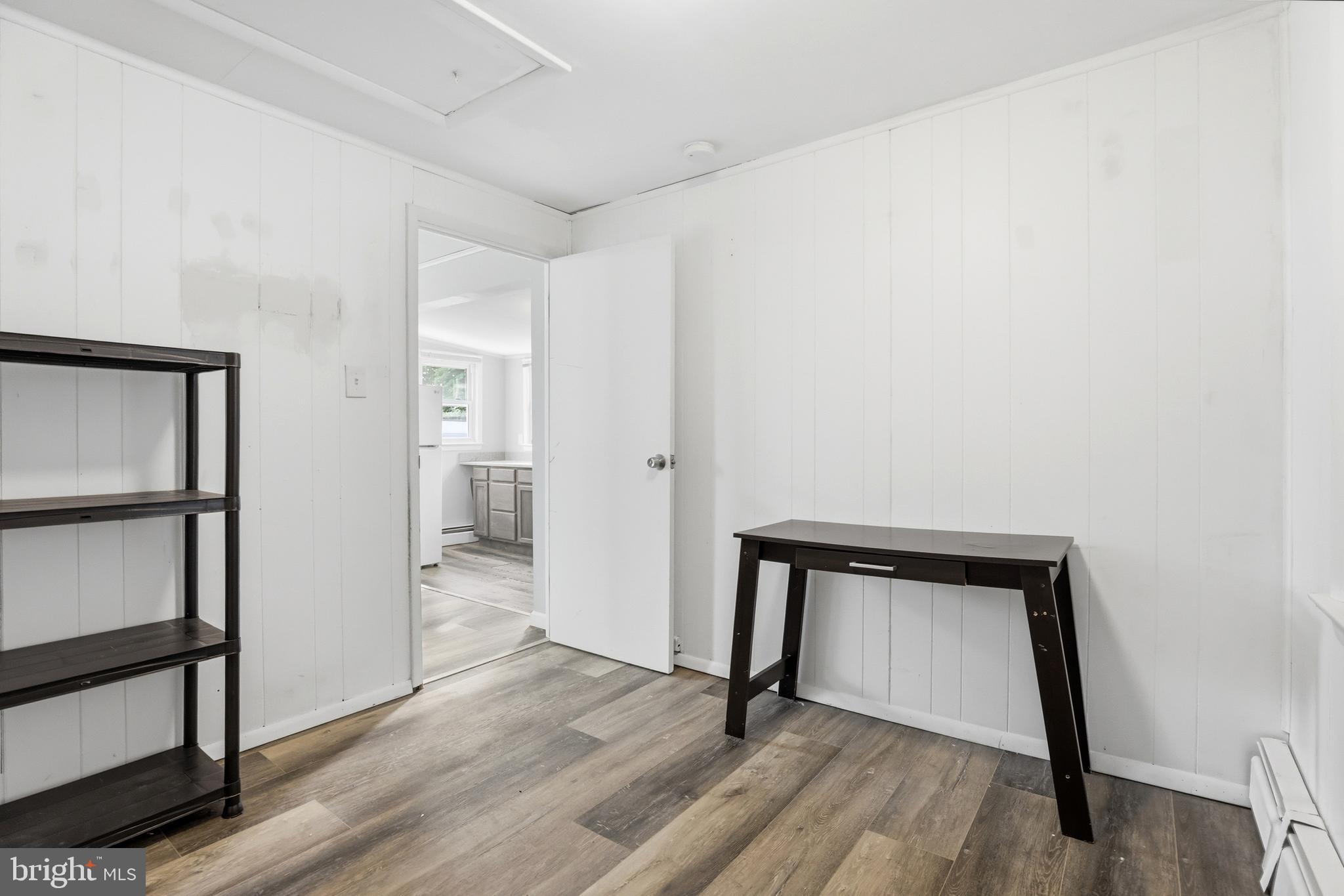 1816 Keymar Road Edgewater, MD 21037 - Photo 11 of 42 a view of an empty room and wooden floor