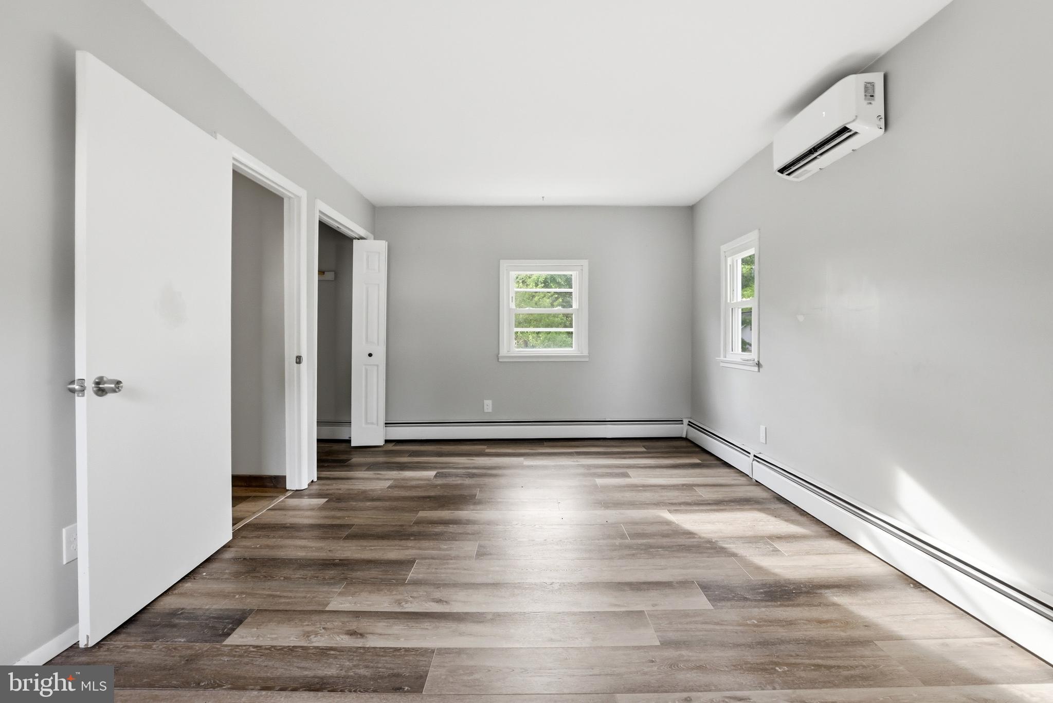 1816 Keymar Road Edgewater, MD 21037 - Photo 20 of 42 a view of an empty room with wooden floor and a window