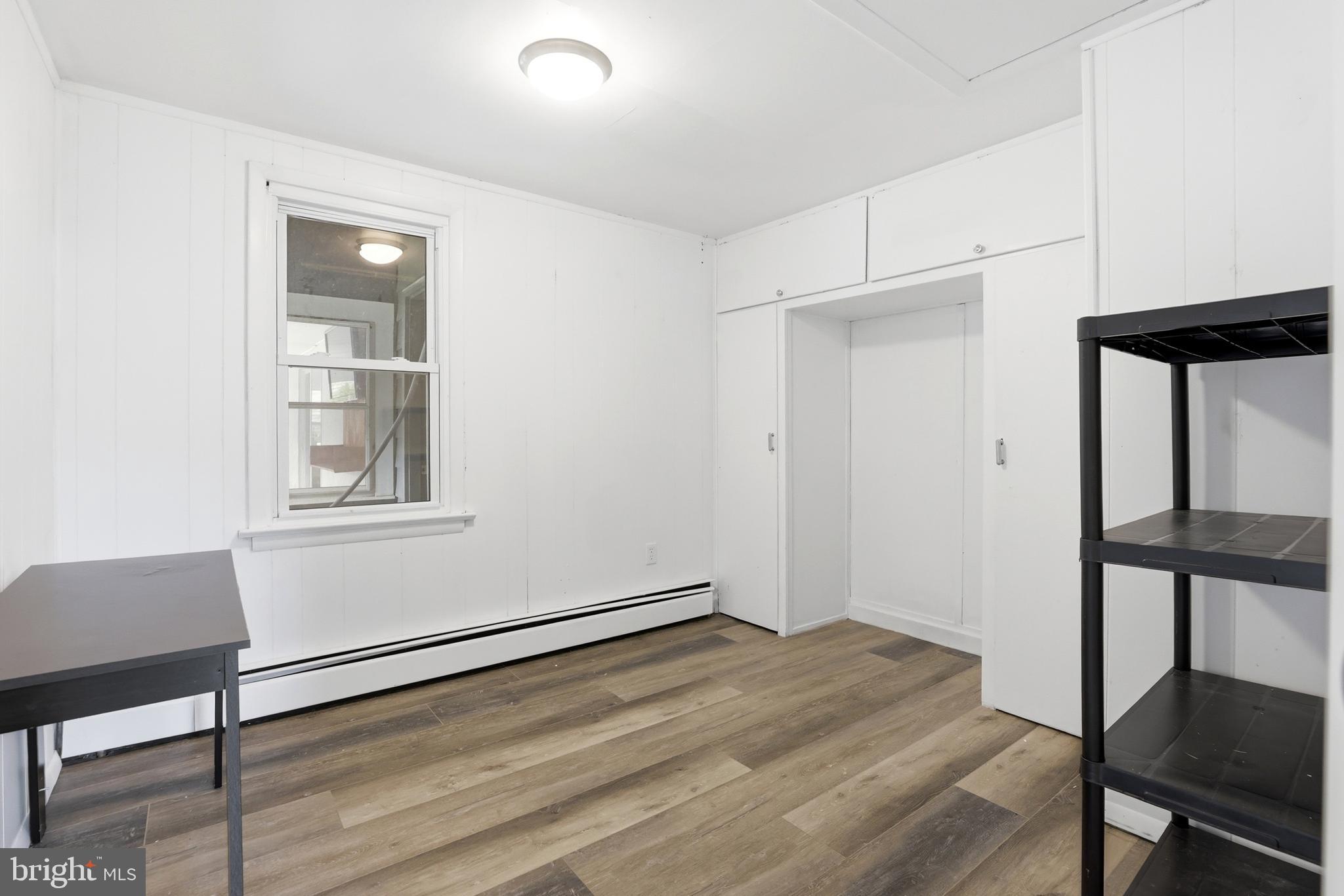 1816 Keymar Road Edgewater, MD 21037 - Photo 9 of 42 a view of empty room with wooden floor and fan