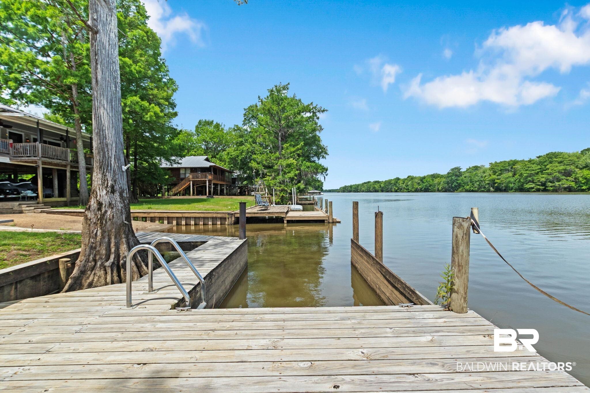 8153 Bryant's Lndg Road Stockton, AL 36579 - Photo 75 of 87 Expansive wood deck with integrated boat slip and ladder access