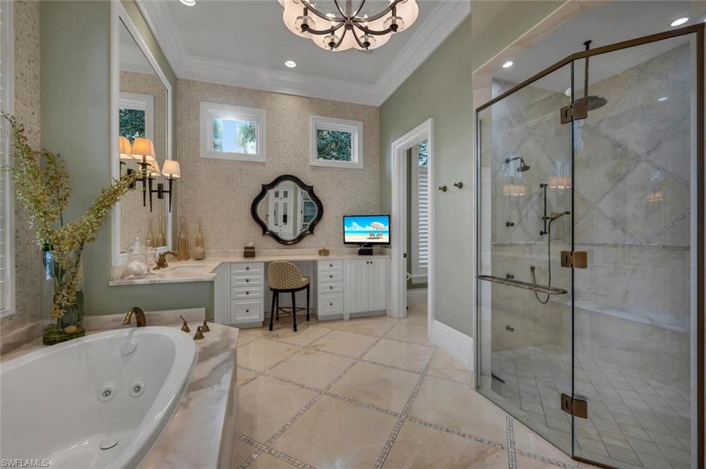 2125 Canna Way Naples, FL 34105 - Photo 22 of 43 Bathroom with vanity, a tub with jets, crown molding, a stall shower, and recessed lighting