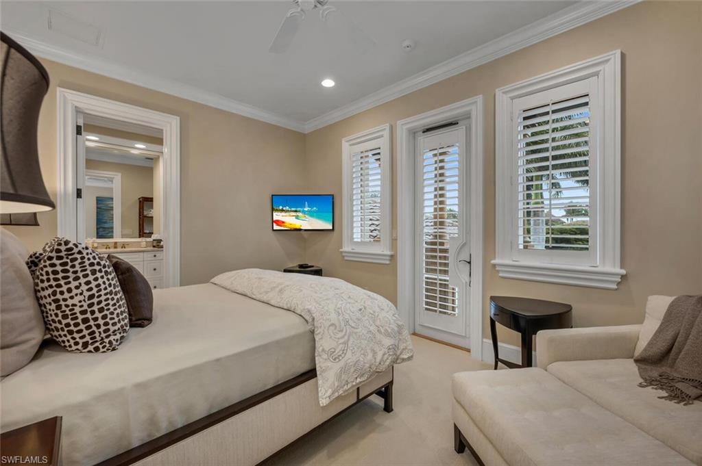 2125 Canna Way Naples, FL 34105 - Photo 30 of 43 Bedroom featuring access to exterior, light colored carpet, a ceiling fan, recessed lighting, and crown molding