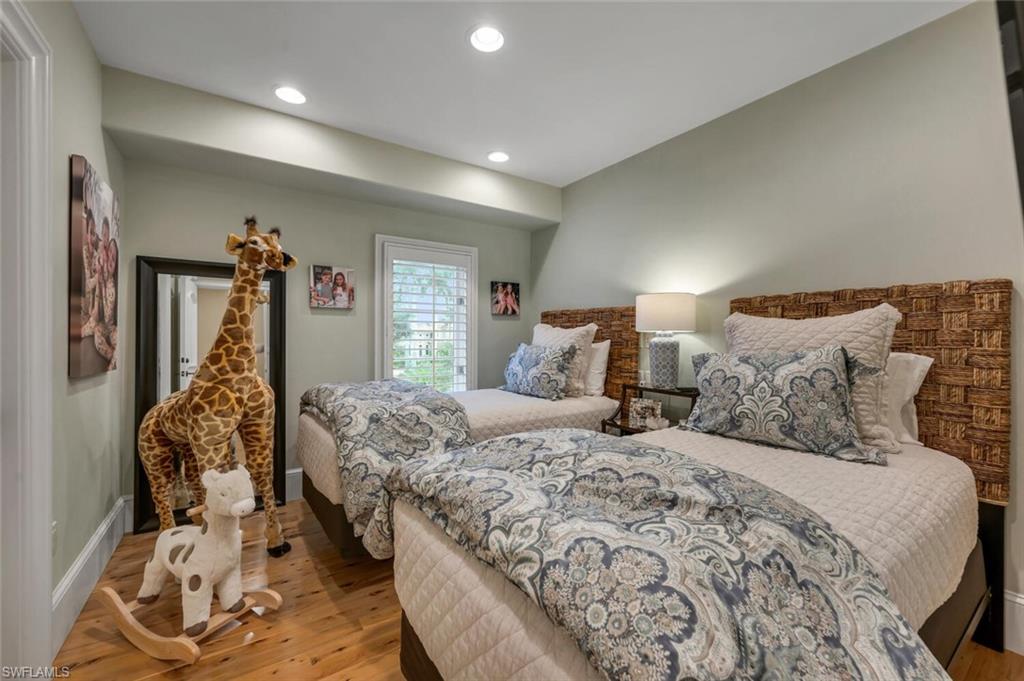 2125 Canna Way Naples, FL 34105 - Photo 31 of 43 Bedroom featuring light wood-style flooring and recessed lighting