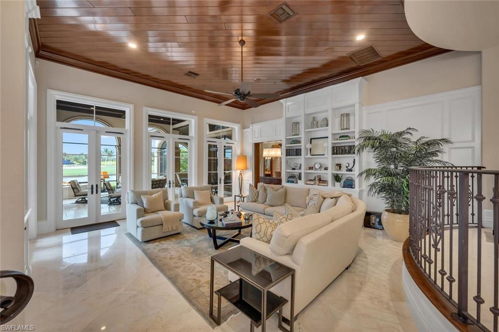 2125 Canna Way Naples, FL 34105 - Photo 8 of 43 Living room with wooden ceiling, a water view, crown molding, french doors, and ceiling fan