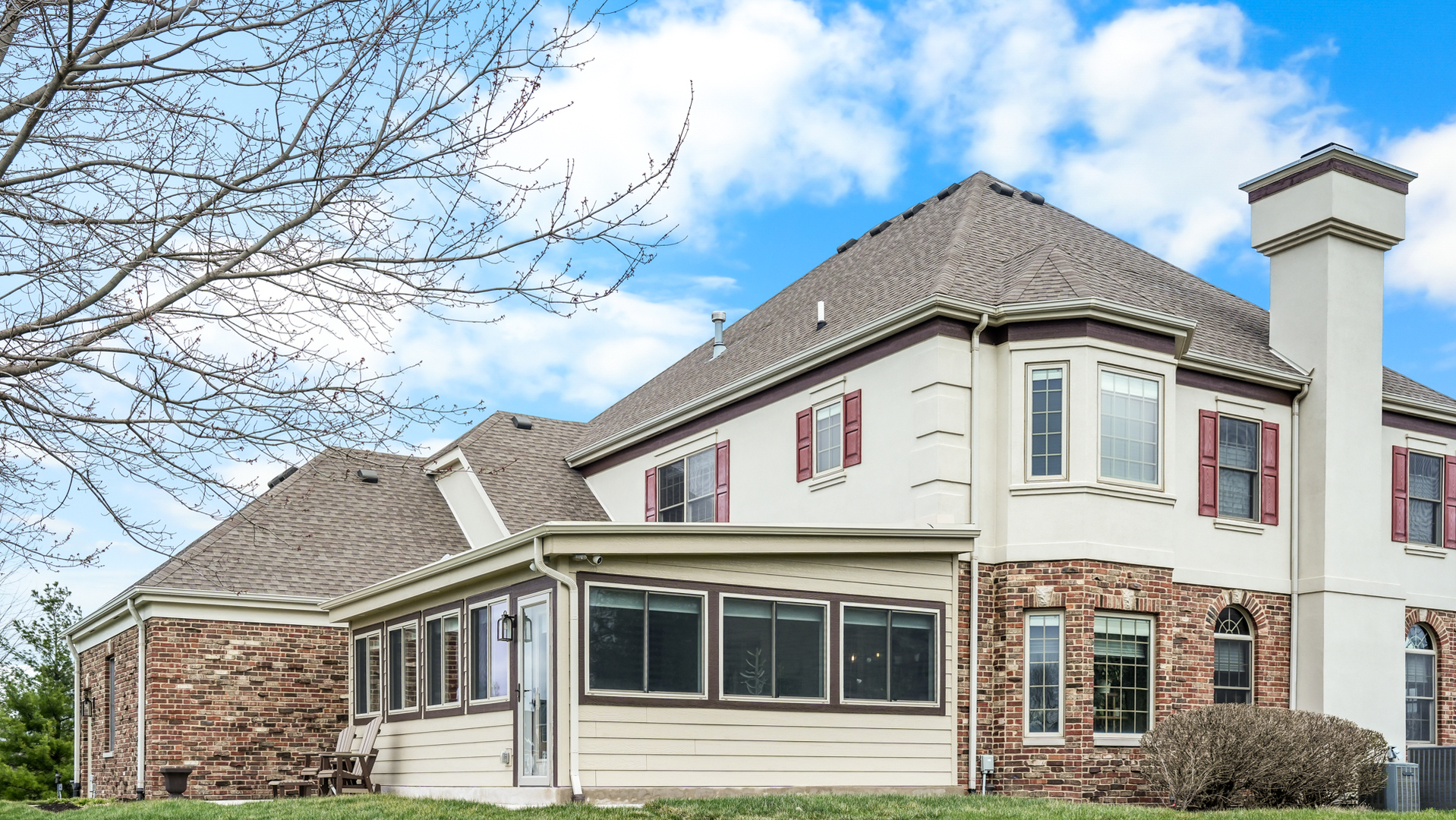 1607 Chestnut Grove Court Champaign, IL 61822 - Photo 112 of 113 a view of a white house with large windows