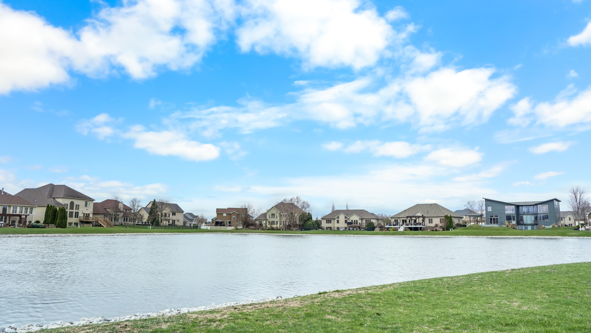 1607 Chestnut Grove Court Champaign, IL 61822 - Photo 113 of 113 a view of a lake with houses in the back