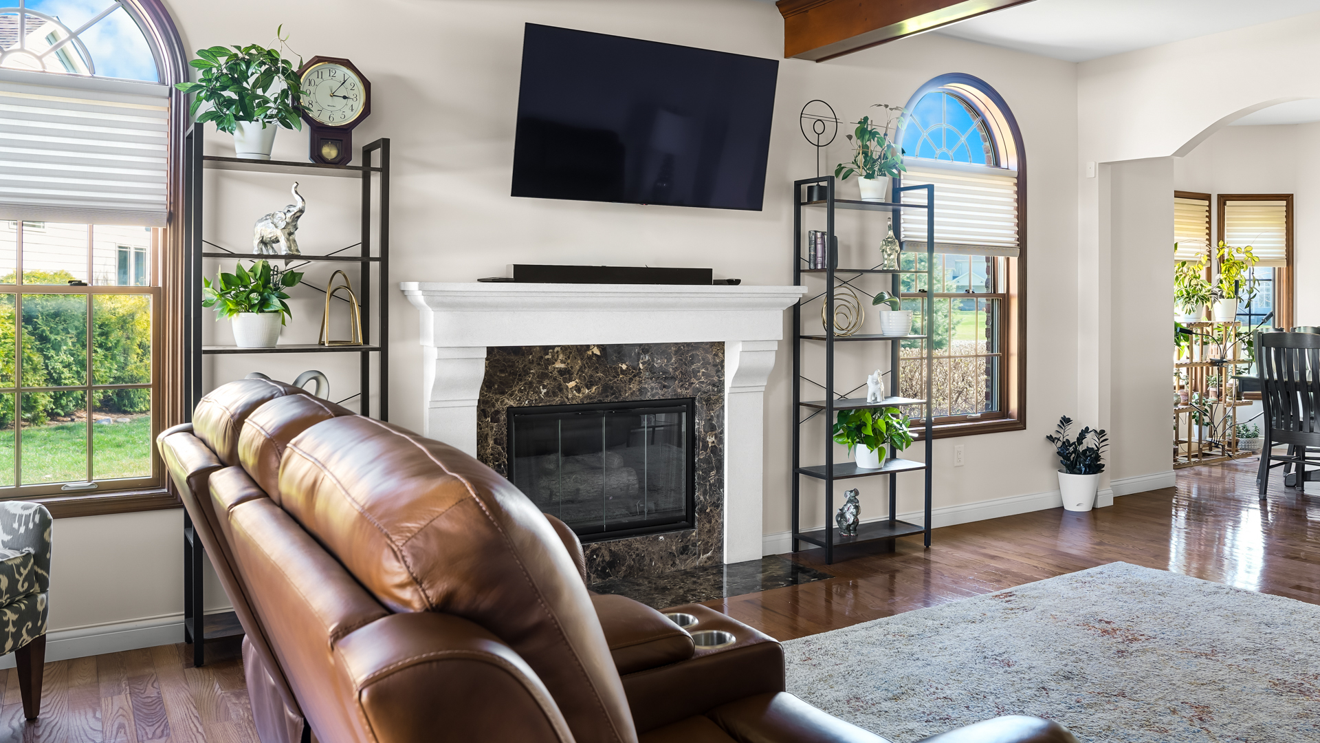 1607 Chestnut Grove Court Champaign, IL 61822 - Photo 19 of 113 a living room with furniture a fireplace and a flat screen tv