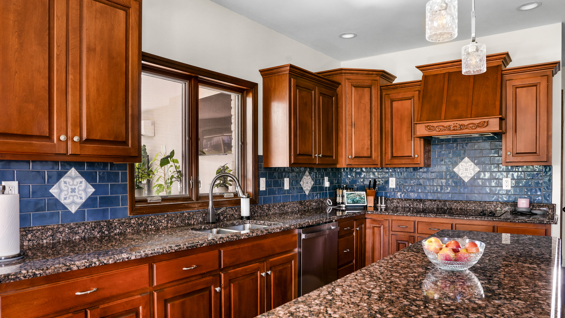 1607 Chestnut Grove Court Champaign, IL 61822 - Photo 29 of 113 a kitchen with stainless steel appliances granite countertop a sink a stove and a wooden cabinets