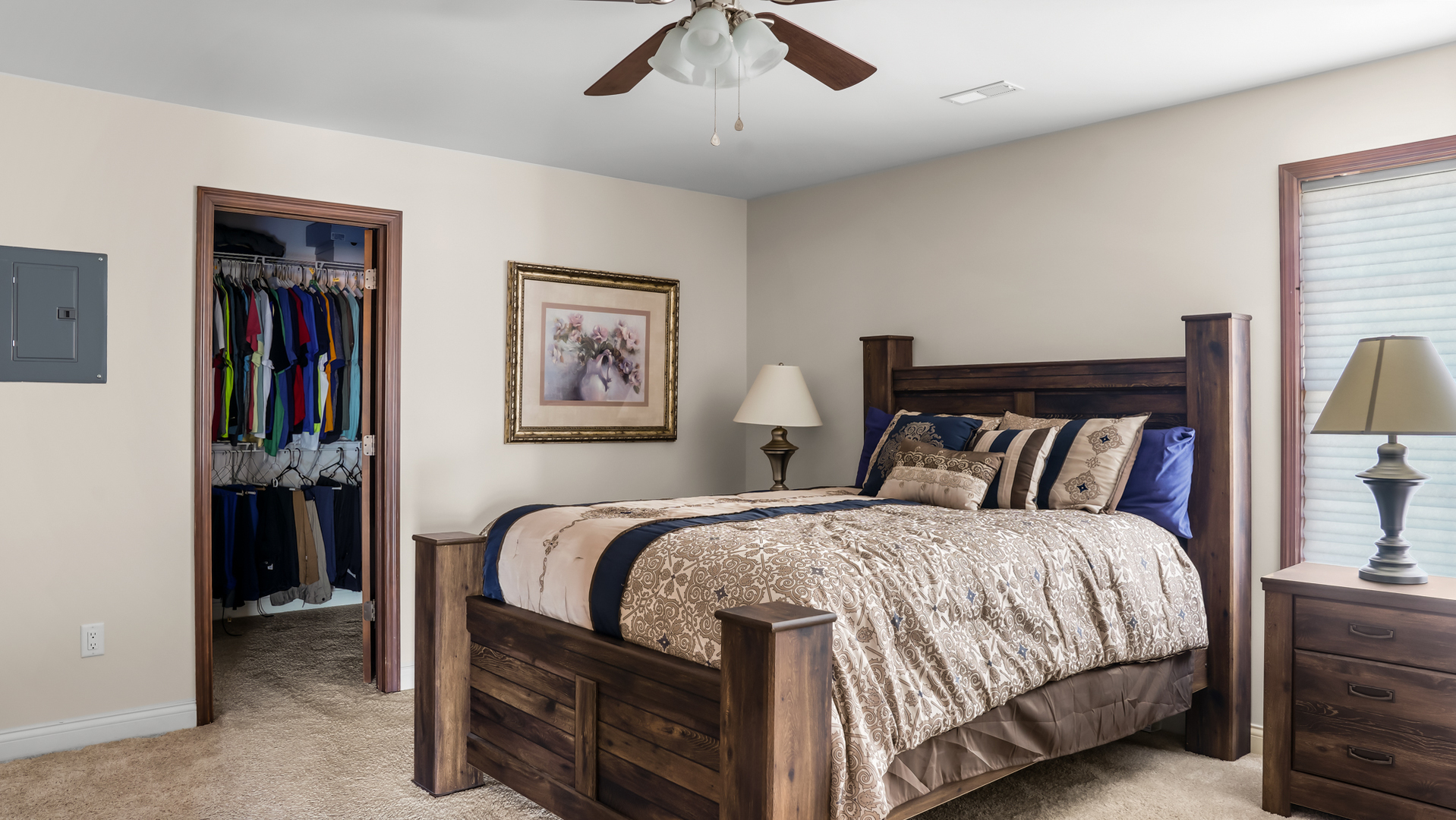 1607 Chestnut Grove Court Champaign, IL 61822 - Photo 72 of 113 a bedroom with a large bed and a chandelier