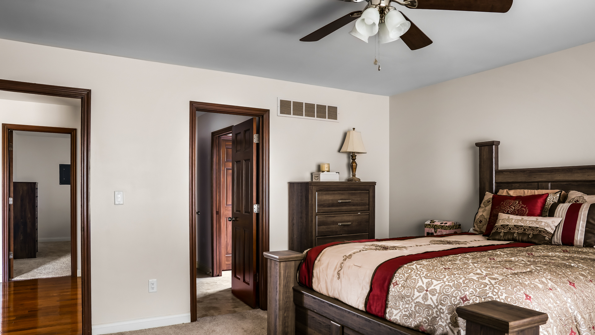 1607 Chestnut Grove Court Champaign, IL 61822 - Photo 84 of 113 a bedroom with a bed and a chandelier