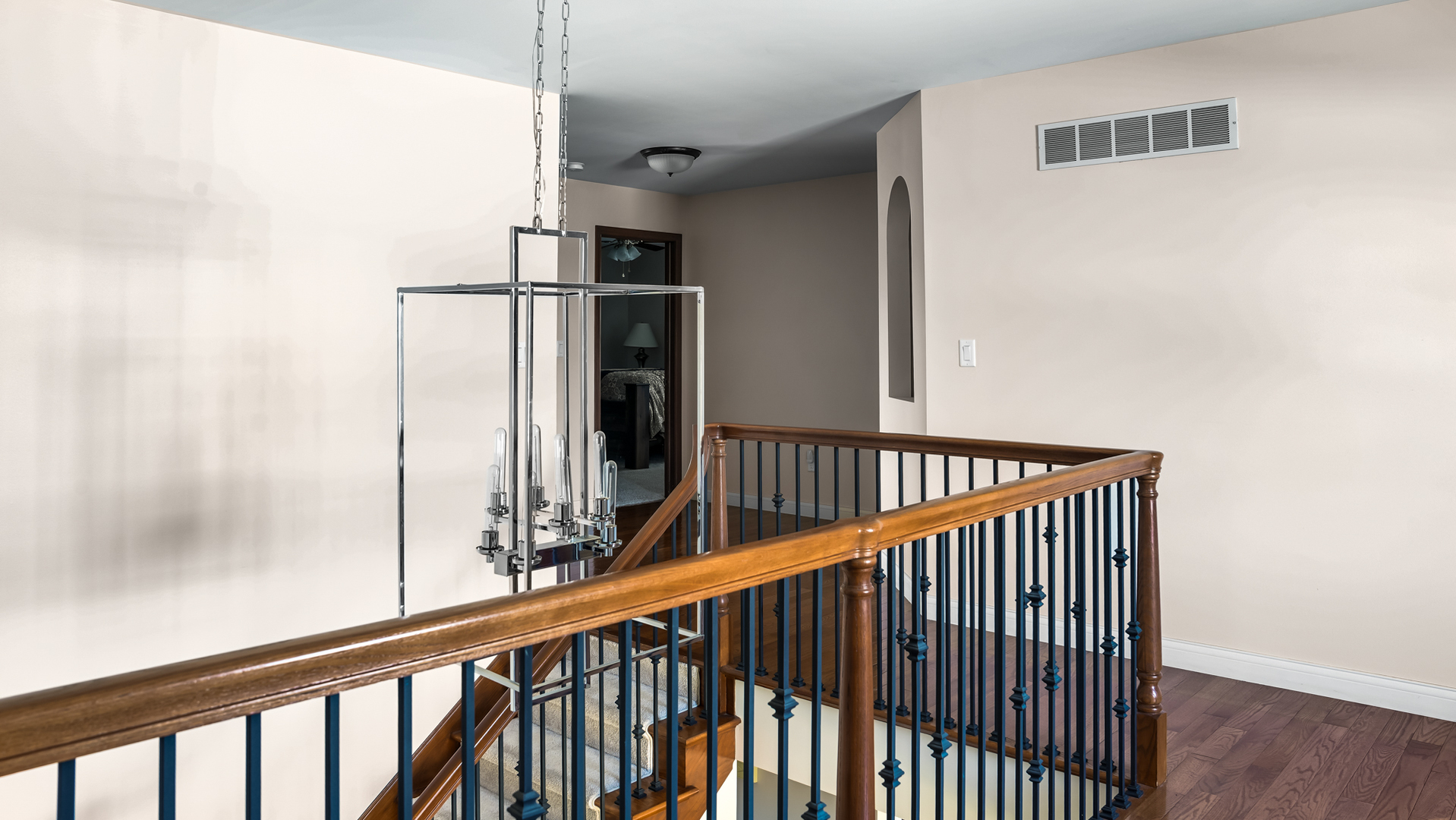 1607 Chestnut Grove Court Champaign, IL 61822 - Photo 85 of 113 a view of a hallway with wooden floor and staircase
