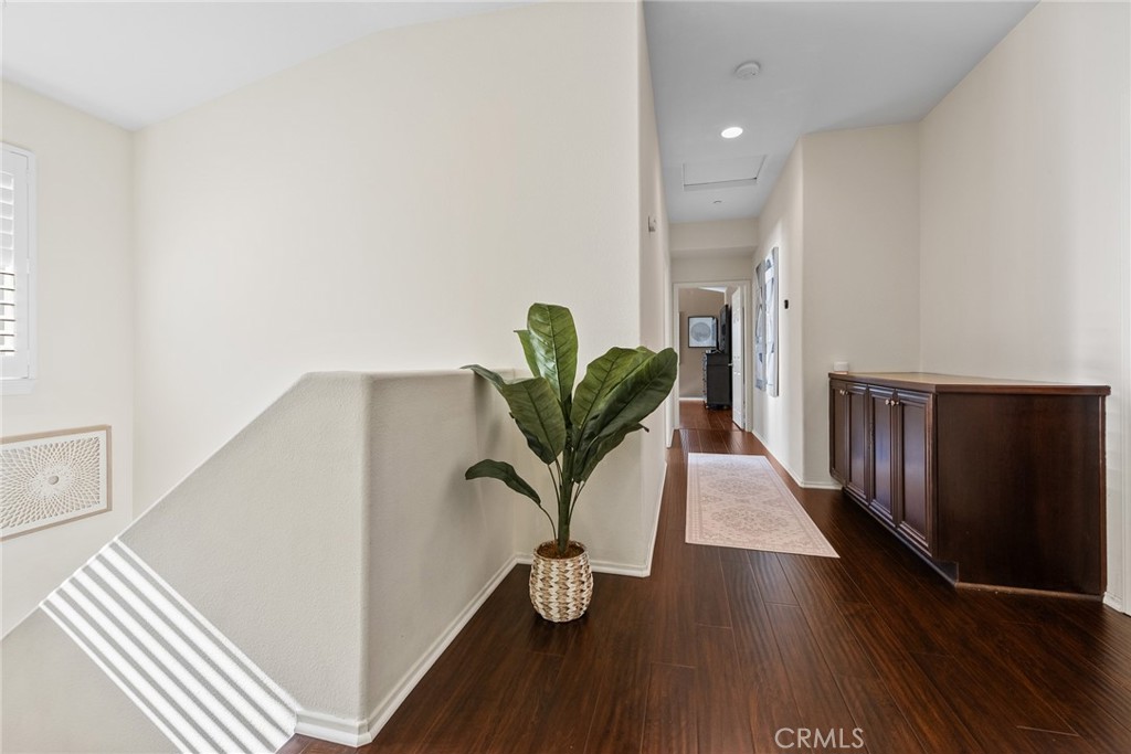 1749 Catania Drive Riverside, CA 92507 - Photo 21 of 39 a view of a hallway with wooden floor