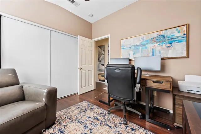 a view of a workspace with furniture and lounge chair
