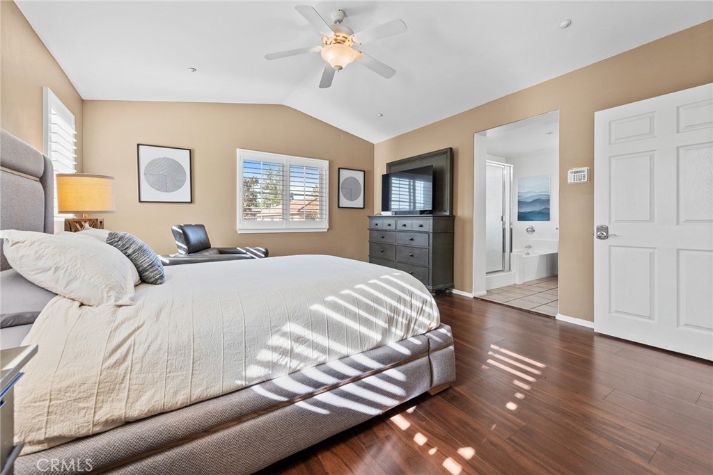 1749 Catania Drive Riverside, CA 92507 - Photo 26 of 39 a bedroom with a bed and a chandelier