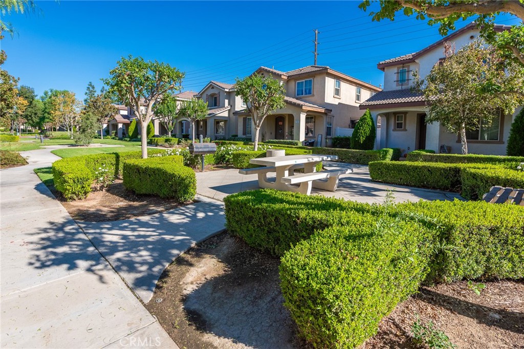 1749 Catania Drive Riverside, CA 92507 - Photo 3 of 39 a front view of a house with a yard table and chairs