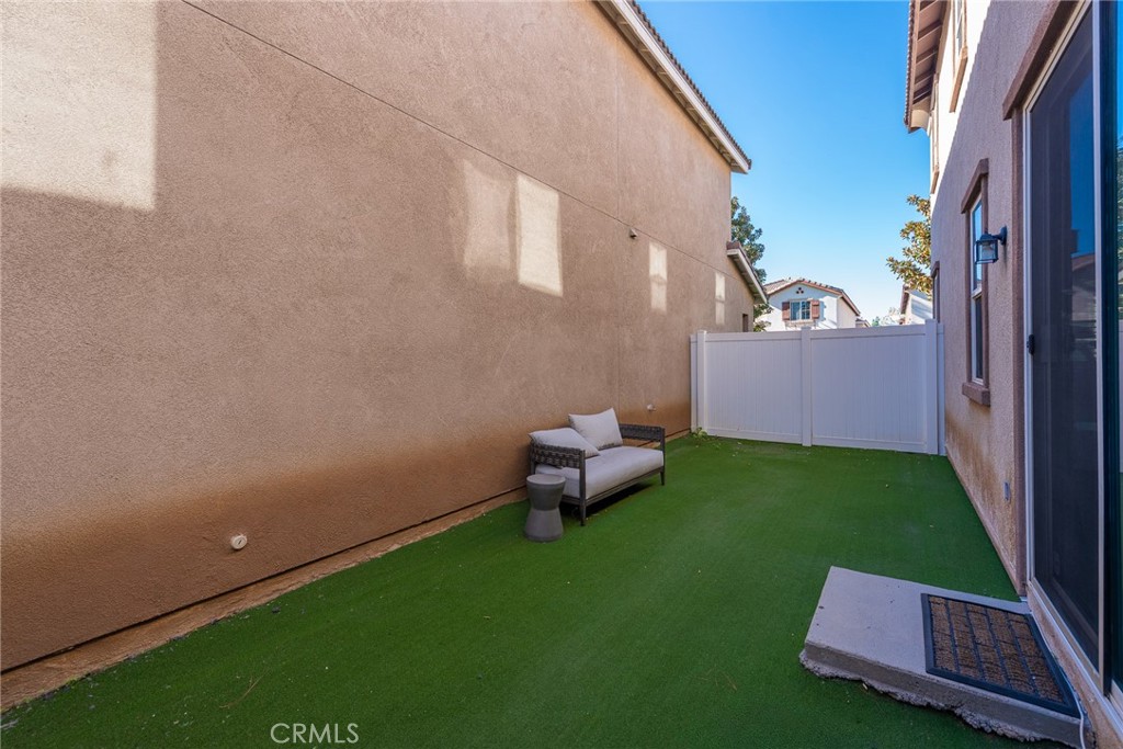1749 Catania Drive Riverside, CA 92507 - Photo 31 of 39 a backyard of a house with table and chairs