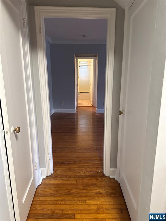 166 Grand Avenue, Unit A7 Englewood, NJ 07631 - Photo 6 of 12 a view of hallway with wooden floor