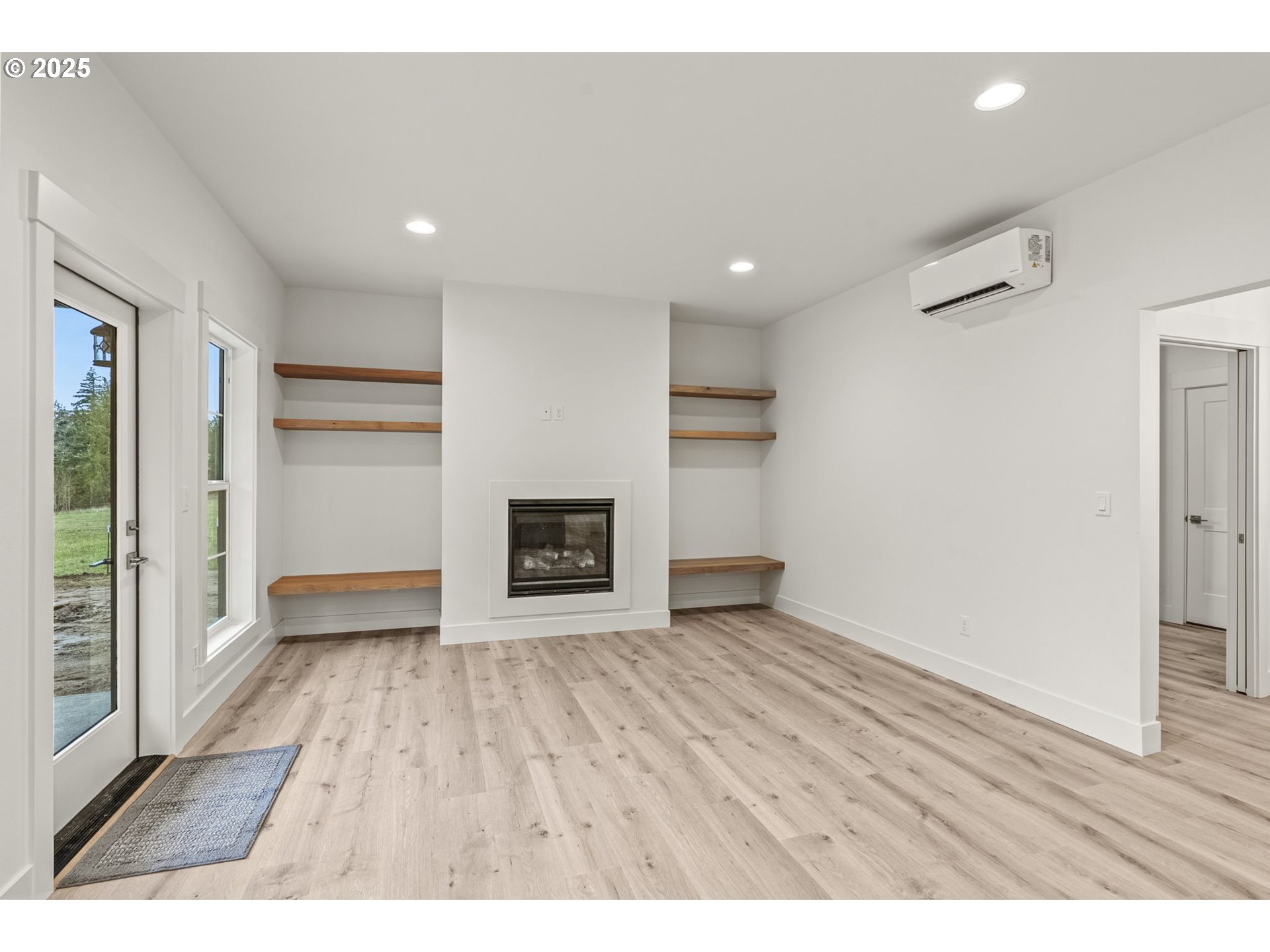 960 Paine Road Castle Rock, WA 98611 - Photo 21 of 32 a view of an empty room with a fireplace