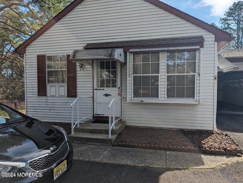 4 D Bristol Street, Unit 51 Whiting, NJ 08759 - Photo 1 of 8 a front view of a house with a balcony