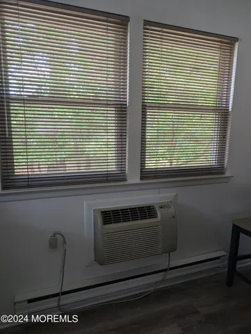 a kitchen with a stove and a window