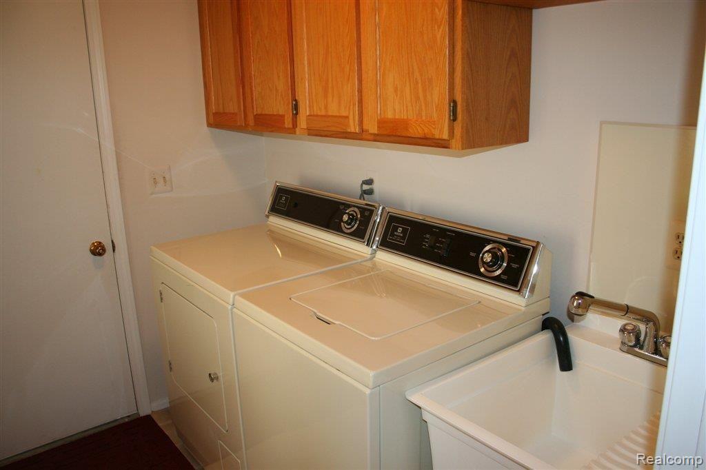 22055 River Ridge Trail, Unit 42 Farmington, MI 48335 - Photo 12 of 25 1st floor laundry!
