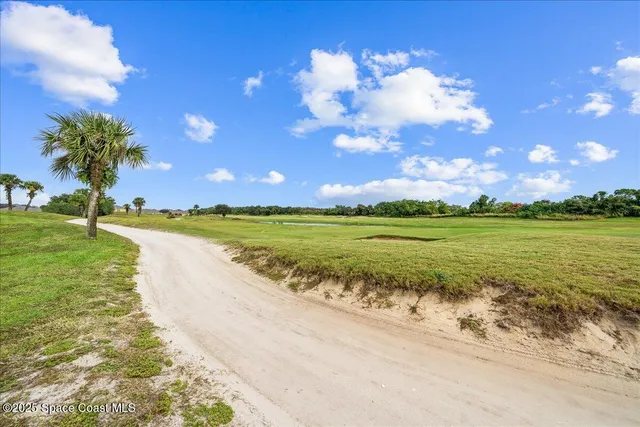 a view of a lake with a big yard