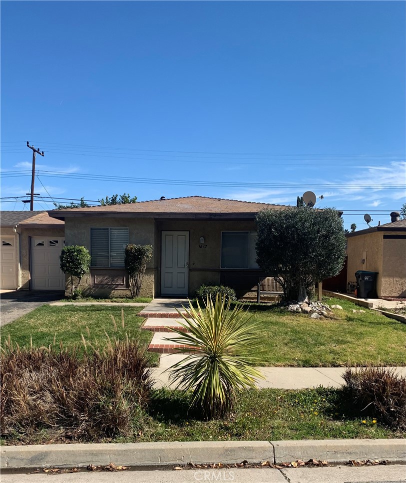 1672 Moreno Drive Simi Valley, CA 93063 - Photo 2 of 10 a view of a house with swimming pool and a yard