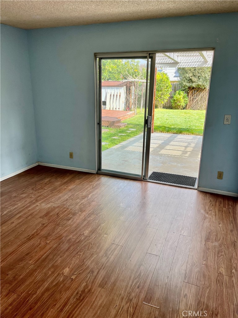 1672 Moreno Drive Simi Valley, CA 93063 - Photo 6 of 10 a view of an empty room with wooden floor and a window