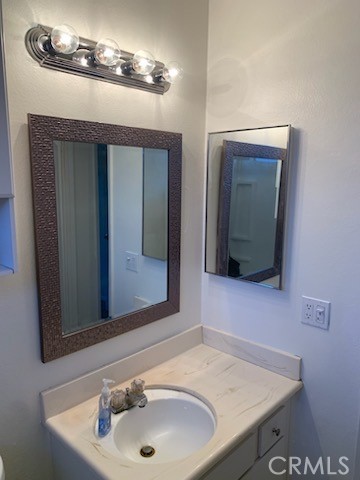 1672 Moreno Drive Simi Valley, CA 93063 - Photo 7 of 10 a bathroom with a sink and a mirror