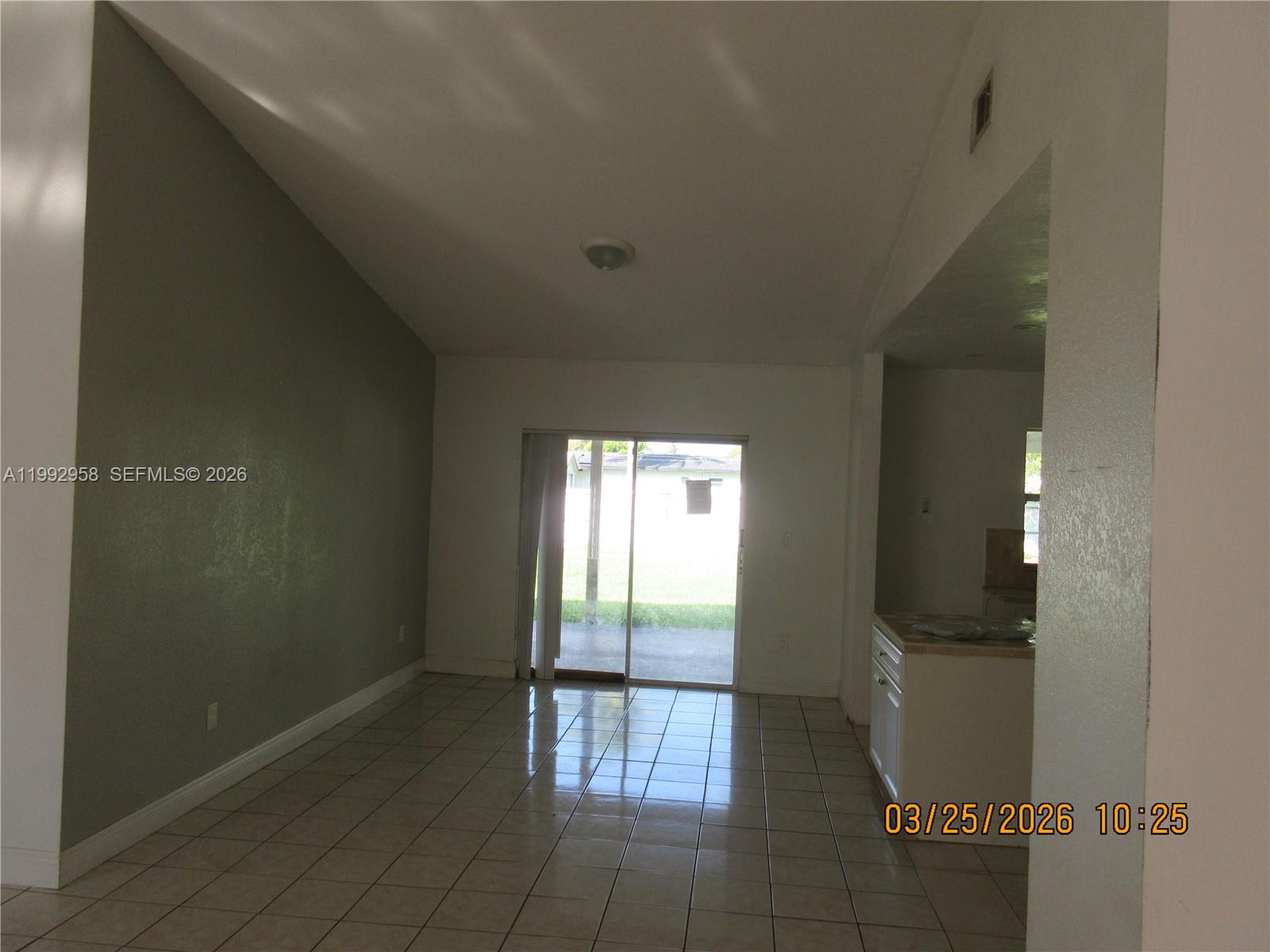 18420 Southwest 129th Avenue Miami, FL 33177 - Photo 3 of 17 a view of an empty room and window