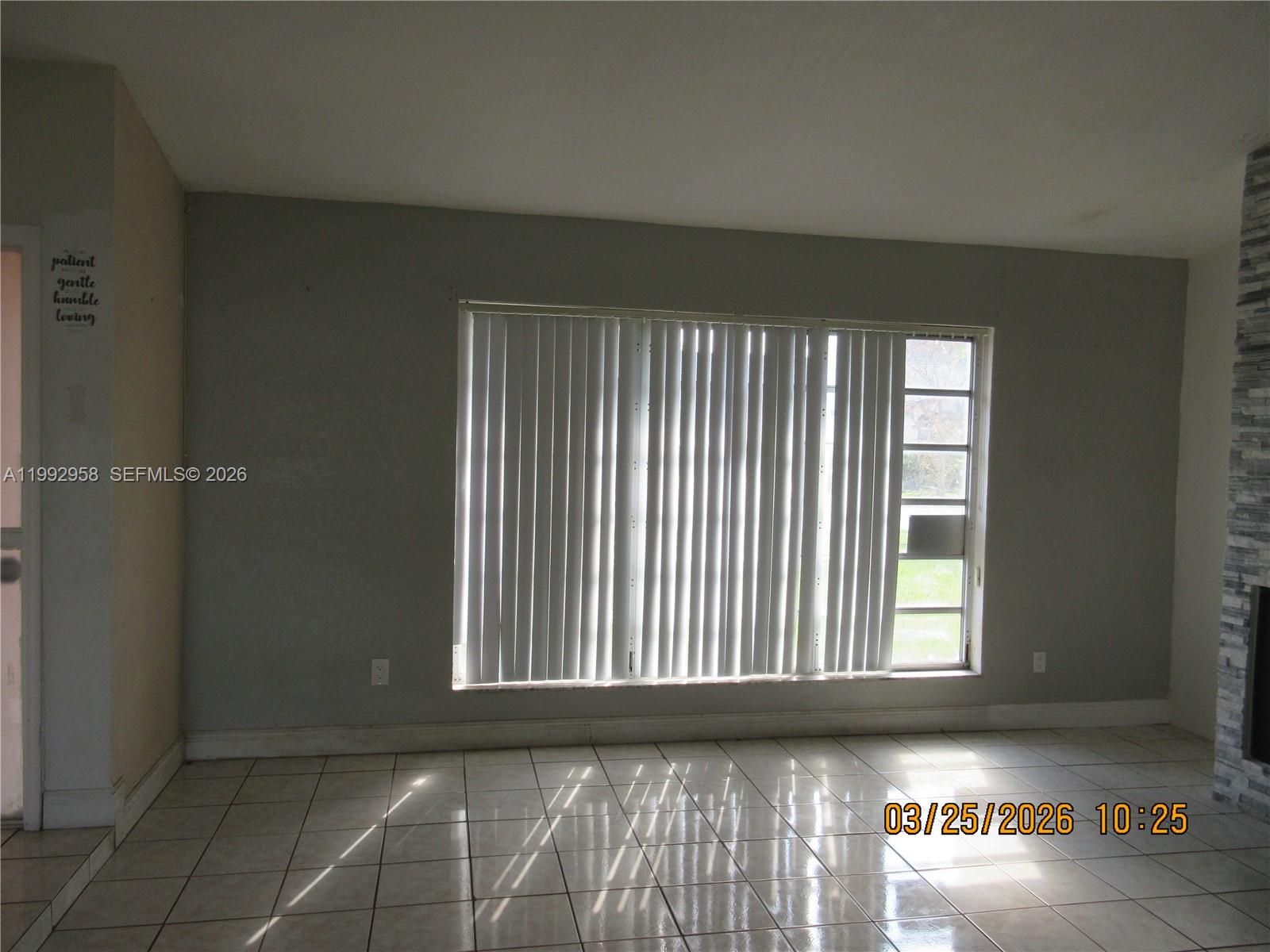 18420 Southwest 129th Avenue Miami, FL 33177 - Photo 7 of 17 an empty room with windows