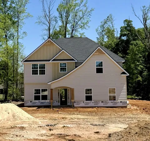 a view of a house with snow in the background