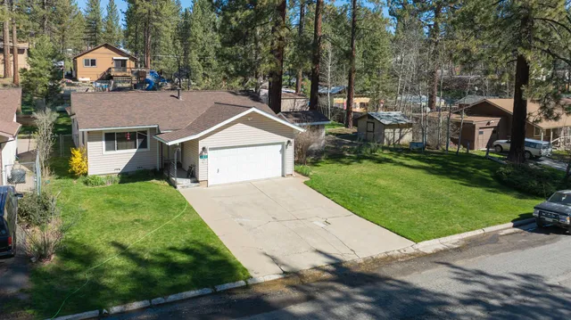 a aerial view of a house with a yard