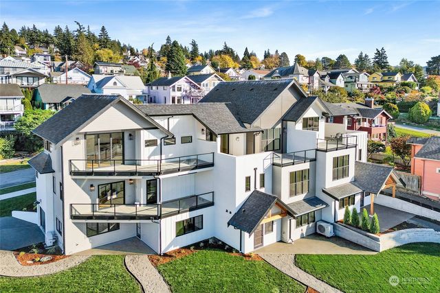 an aerial view of a house with swimming pool garden and patio