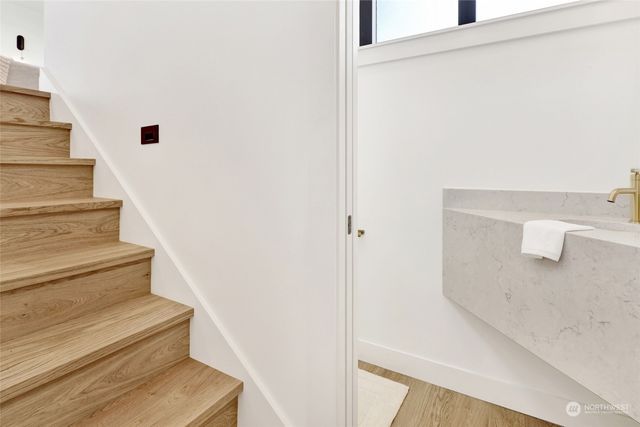 a view of hallway with window and stairs