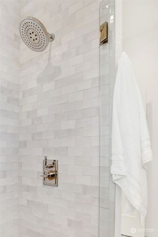 a bathroom with a glass shower door