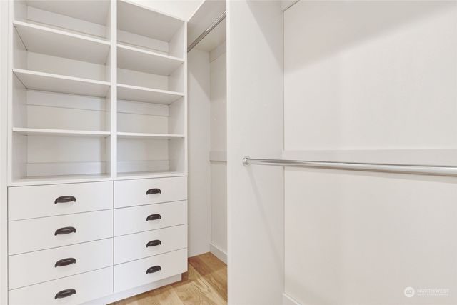 a bathroom with a sink a mirror and a bathtub
